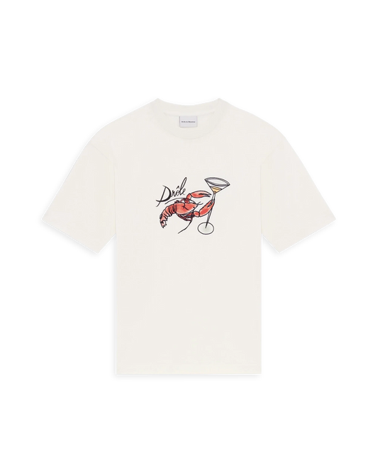 Le T-shirt Homard offwhite t-shirt med hummertryck. Broderad Hummer som håller i coktailglas. Brösttryck