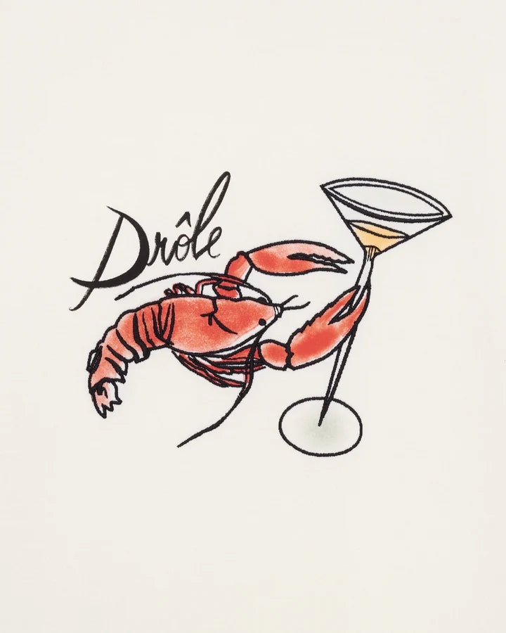 Le T-shirt Homard offwhite t-shirt med hummertryck. Broderad Hummer som håller i coktailglas. Brösttryck